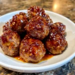 Crockpot filled with sweet chili glazed meatballs.