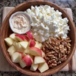 Cottage cheese apple bites in mini cups with cinnamon dusting