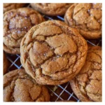 Freshly baked maple cookies cooling on a rack
